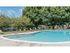 Community swimming pool with lounge chairs on the sundeck at Park City apartments in Lancaster, PA.