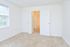 Bedroom with beige carpeting and sunny window in Phoenixville, PA apartments for rent