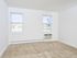 Two windows and air conditioning unit in Knollwood Apartments bedroom