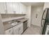 Kitchen with granite countertops and white cabinets at Fox Run apartments for rent