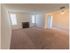Living room with open space and a fireplace at Fox Run apartments for rent in Warminster, PA