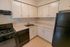 Model kitchen with modern appliances at Oak Forest Apartments in Reading, PA.