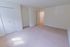 Carpeted model bedroom double closets at Oak Forest Apartments in Reading, PA.