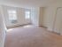 Carpeted model bedroom with large windows and double closets at Oak Forest Apartments in Reading, PA.