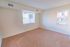 Bedroom with beige carpet and a window at Allandale Village apartments for rent in Newark, DE