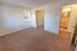 Bedroom with beige carpet and a window at Allandale Village apartments for rent in Newark, DE