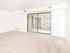 Large living space with sliding glass doors out to private balcony in Lansdowne, PA apartment for rent