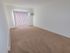 Living room with beige carpet and a sliding door to a balcony or patio at Gayley Park apartments for rent in Media, PA