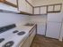 Kitchen with brown and white cabinets at Gayley Park apartments for rent in Media, PA