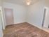 Living room with vinyl flooring and a ceiling fan at Gayley Park apartments for rent
