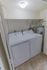 In-unit laundry room with full sized washer and dryer at Whiteland West Apartments in Exton, PA.