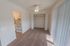 Dining room with beige carpet, a closet, and ceiling fan at Black Hawk apartments for rent