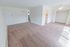 Living room with beige carpet and a closet at Black Hawk apartments for rent in Downingtown, PA