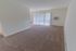 Living room with beige carpet and a closet at Black Hawk apartments for rent in Downingtown, PA