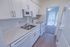Kitchen with white appliances at Black Hawk apartments for rent in Downingtown, PA