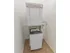 In-unit stacked washer and dryer in an apartment at Mayflower Crossing Apartments in Wilkes-Barre, PA.