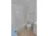 Tiled bathroom with a tub shower, toilet and sink with vanity at Mayflower Crossing Apartments in Wilkes-Barre, PA.