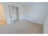 Carpeted bedroom with closet at Mayflower Crossing Apartments in Wilkes-Barre, PA.
