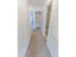 Carpeted hallway with a linen closet at Mayflower Crossing Apartments in Wilkes-Barre, PA.