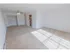 Carpeted living room in 1 bedroom apartment in Mayflower Crossing Apartments in Wilkes-Barre, PA.