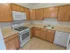 Kitchen with tiled flooring and modern appliances at Mayflower Crossing Apartments in Wilkes-Barre, PA.