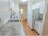 Kitchen with white cabinets and appliances in apartment for rent in West Chester, PA