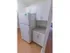 White cabinets and counter space with tiled backsplash