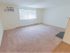 Large carpeted living room in West Chester, PA apartment for rent