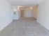 Carpeted living room and dining areas at The Lafayette at Valley Forge apartments in King of Prussia, PA.