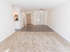 Carpeted living room and dining areas at The Lafayette at Valley Forge apartments in King of Prussia, PA.