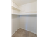 Walk-in closet with clothes rods and built-in shelves at The Lafayette at Valley Forge apartments in King of Prussia, PA.