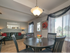 Furnished dining area with hardwood floors and window in Woodbury, NJ townhome for rent