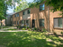 Tall trees bring shade to exterior of townhomes in Woodbury, NJ