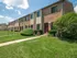 Well-kept grass and meticulous landscaping outside of Woodbury, NJ townhomes