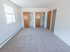Large bedroom with two closets and a sizable window at Evergreen Club apartments for rent in Broomall, PA