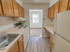 Kitchen with ample counter space and vinyl flooring at Evergreen Club apartments for rent in Broomall, PA