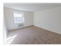 Spacious bedroom with plush carpeting and large windows at Evergreen Club apartments for rent in Broomall, PA