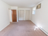 Large bedroom with baseboard heating and two closets at Evergreen Club apartments for rent in Broomall, PA