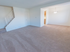 Beige carpeting in spacious living and dining area in Red Bank Run Townhomes for rent