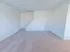 Large living room and stairs leading to second floor of two-story townhomes