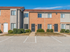 Parking lot and entrances to townhomes for rent in Woodbury, NJ