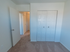 Small bedroom with carpeting that doubles as office or work from home space
