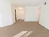 Carpeted living room looking towards the front door at Winslow House Apartments in Blackwood, NJ.