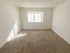 Carpeted bedroom with a large window at Winslow House Apartments in Blackwood, NJ.