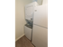 In-unit laundry area with stacked washer and dryer at Wyntre Brooke apartments in West Chester, PA.