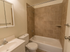 Model bathroom with vanity sink, toilet and tub shower at Wyntre Brooke apartments in West Chester, PA.