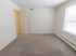 Carpeted bedroom with a large window at Wyntre Brooke apartments in West Chester, PA.