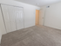 Carpeted bedroom with closet at Wyntre Brooke apartments in West Chester, PA.