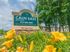 Green welcome sign at Caln East apartments for rent in Downingtown, PA