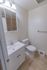 Model bathroom with vanity sink and toilet at Paoli Place Apartments in Paoli, PA.